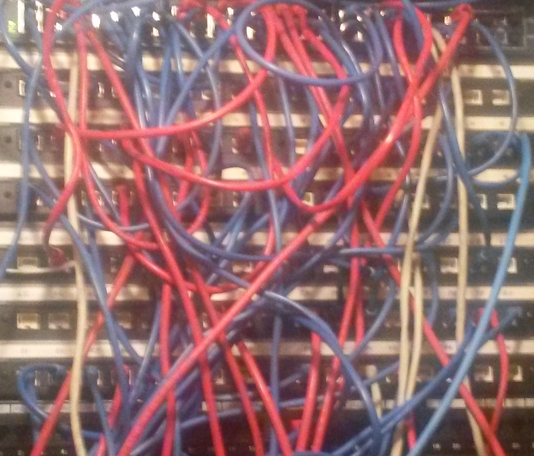 Tangled network cables illustrating IT complexity