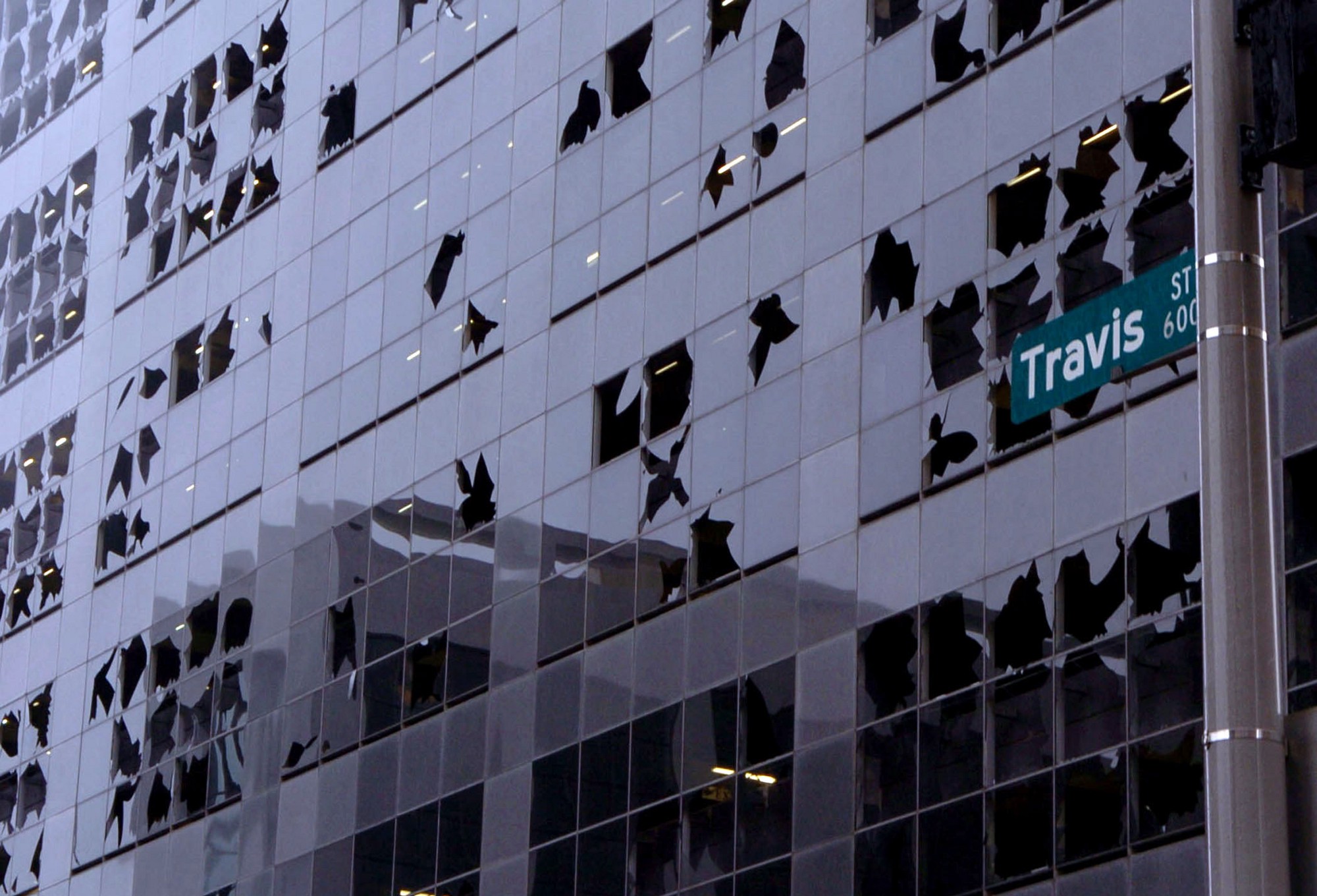Building with a broken window illustrating broken windows theory